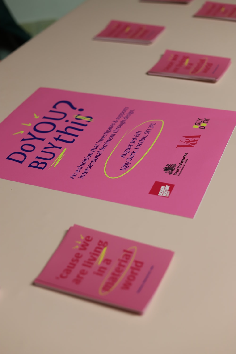 Pink posters on display on a table