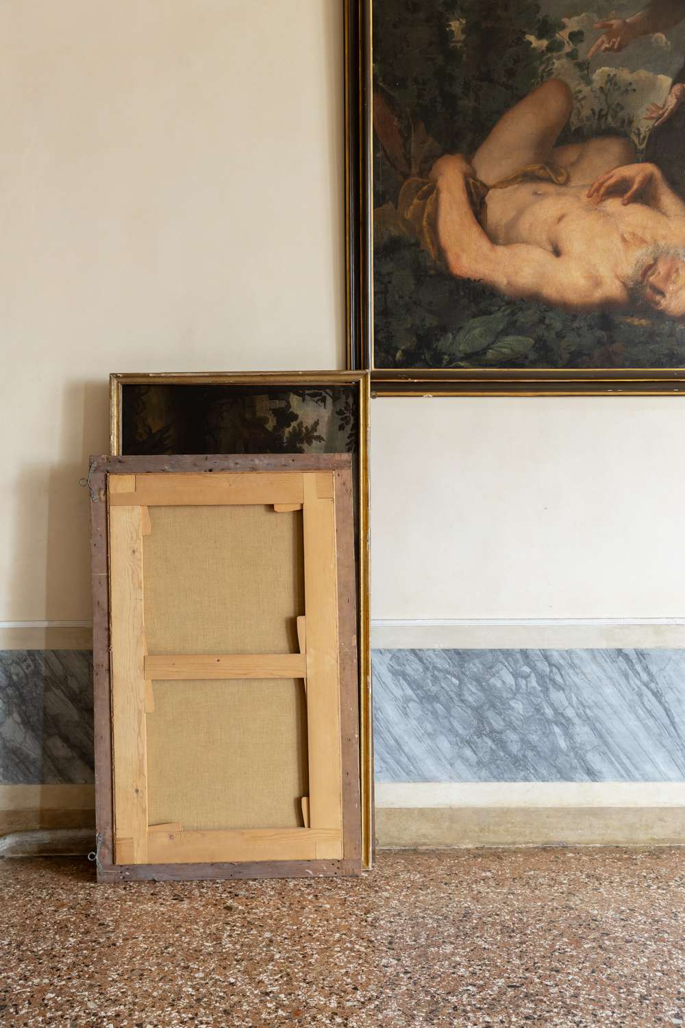 Details of a room in a Venetian palace featuring antiques and paintings