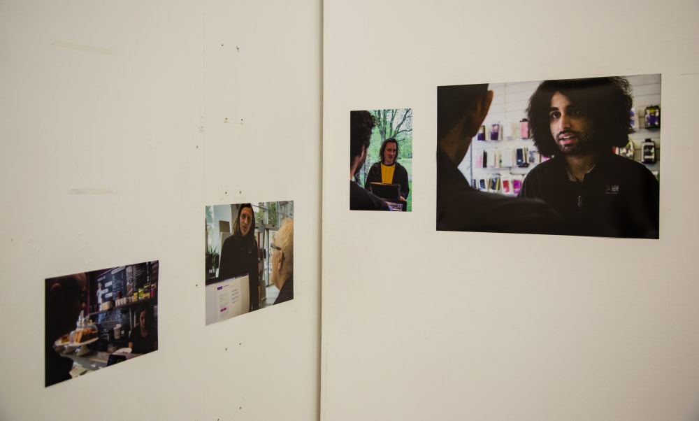 four photography prints on display at an exhibition