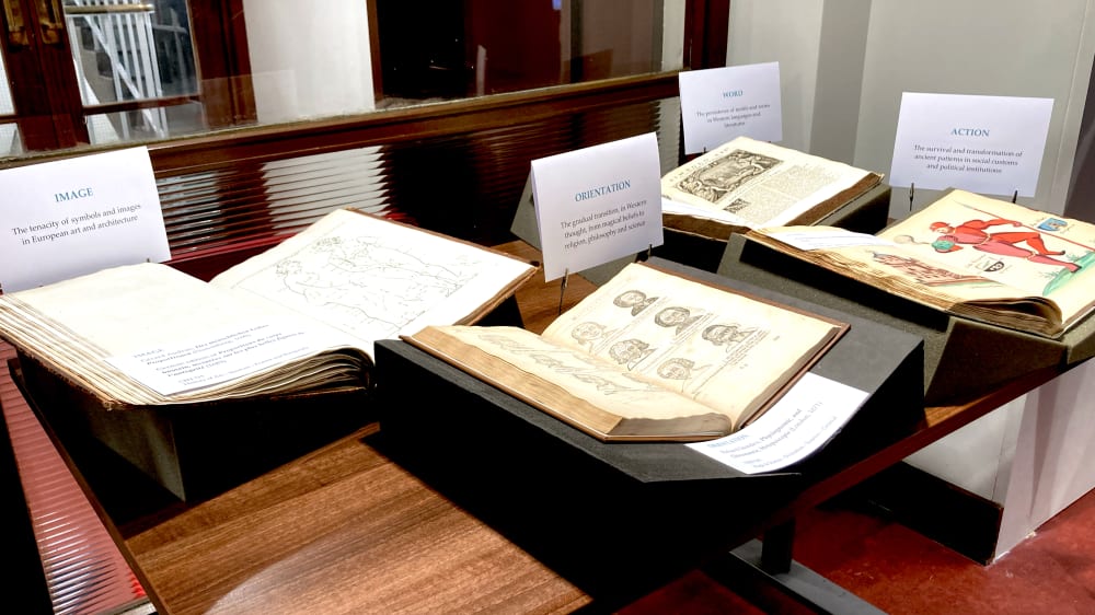 a table with books open displaying pages