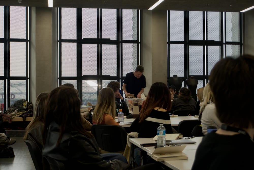 Students in a classroom watching a demonstration..