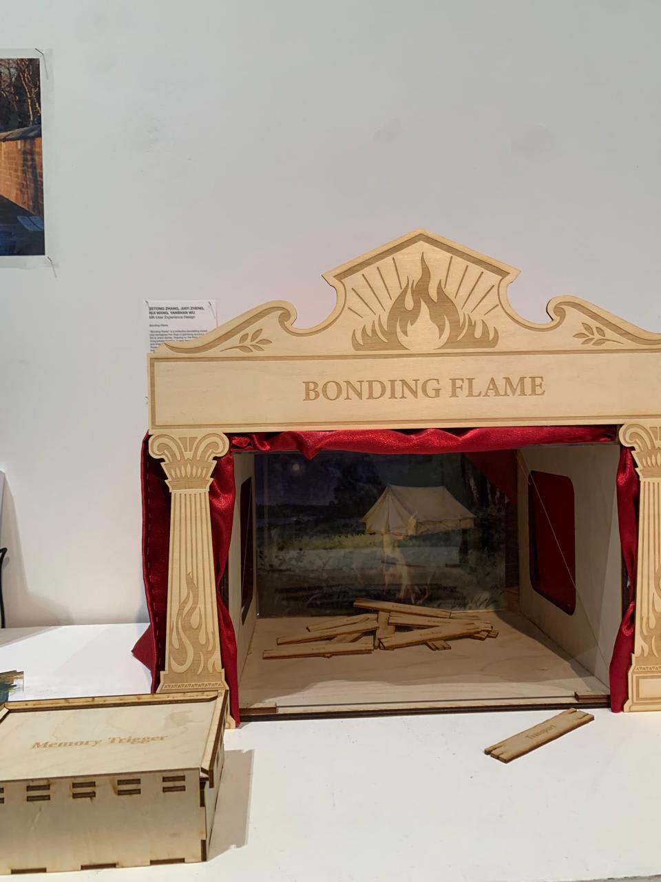 Small wooden structure with red velvet curtains