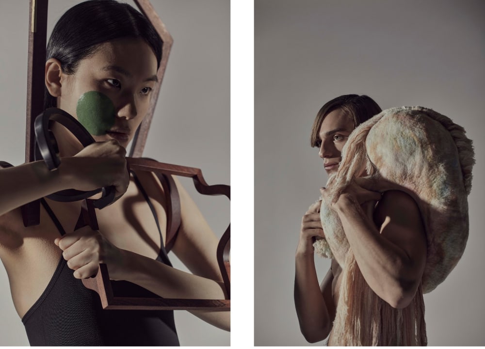 A split image features two individuals. On the left, a person with black hair holds a wooden frame and a green object to their face, creating an abstract look. On the right, another person with light brown hair drapes a soft, textured fabric around their shoulders, exuding a thoughtful, pensive mood. Both are set against a neutral background, highlighting the artistic, introspective tone.
