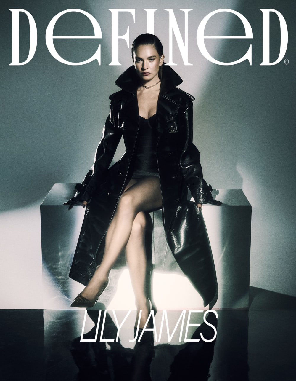 Defined magazine cover with acress Lily James wearing a long leather black trench.