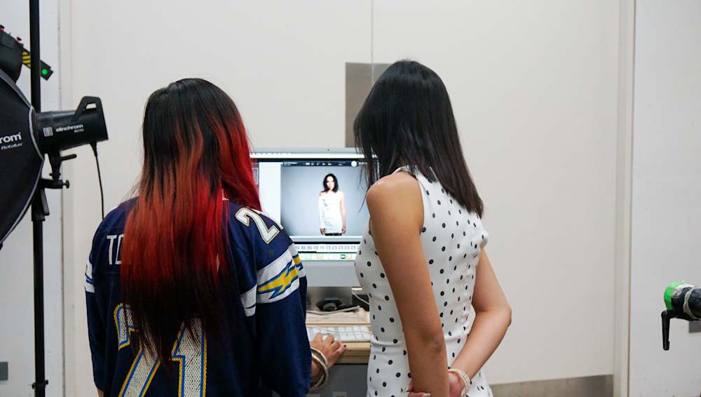 Two people looking at a computer screen
