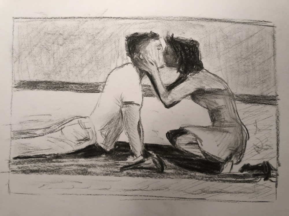 A charcoal or pencil drawing on a an off white page of a couple kissing. He is lying stretching and she is sitting with his head in her hands.