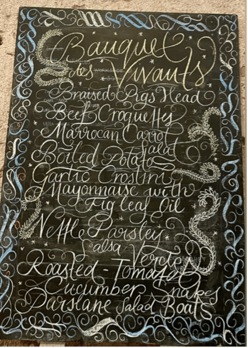 an illustrated menu on a blackboard