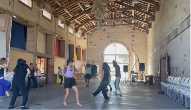 people dancing in a big hall