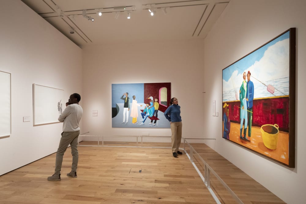 Visitors looking at works on display at the National Portrait Gallery