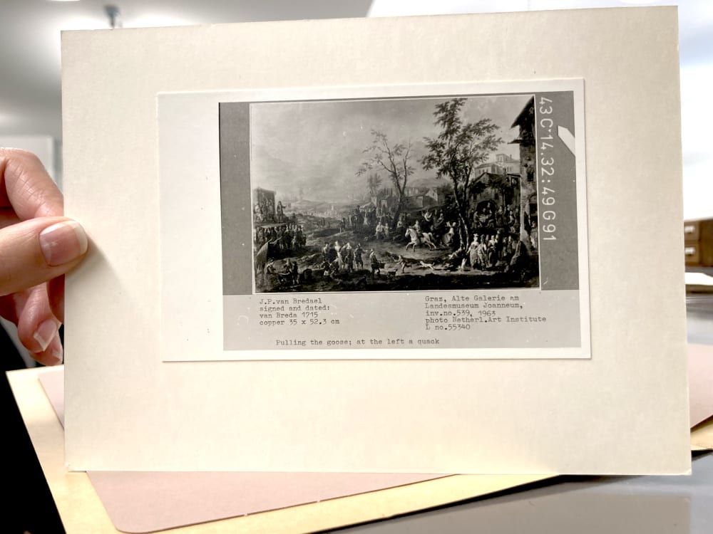 a hand holding a photograph