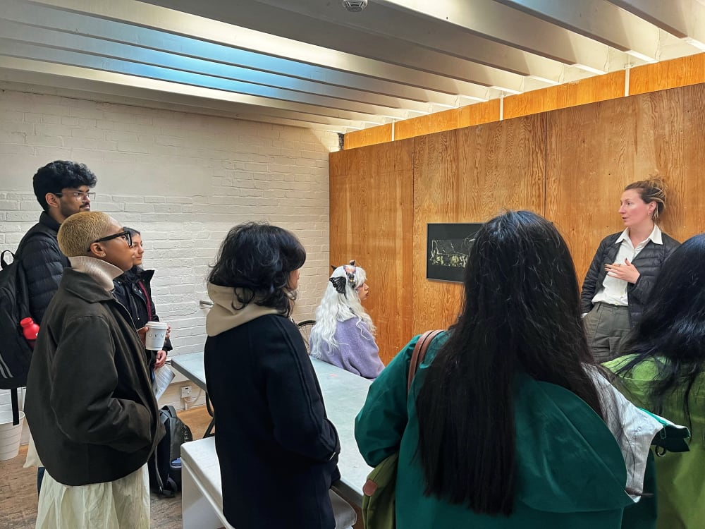 a group of people talking in a meeting room