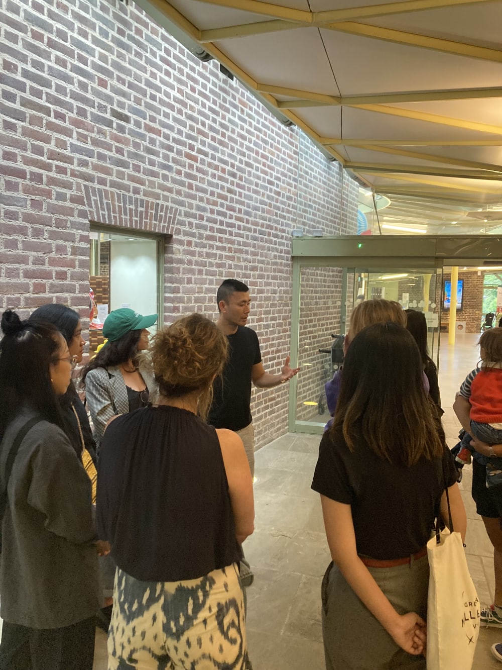 Curator speaking to students