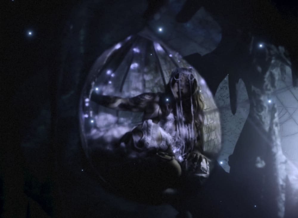 person wrapped in a transparent cocoon