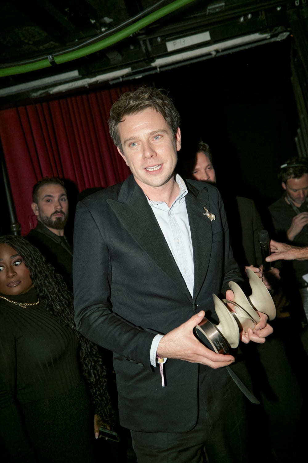 Jonathan Anderson backstage with his award