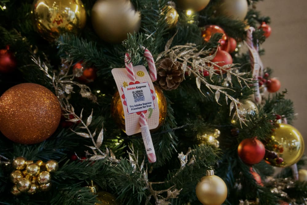 Candy cane in a Christmas tree with 'Adobe Express' written on.