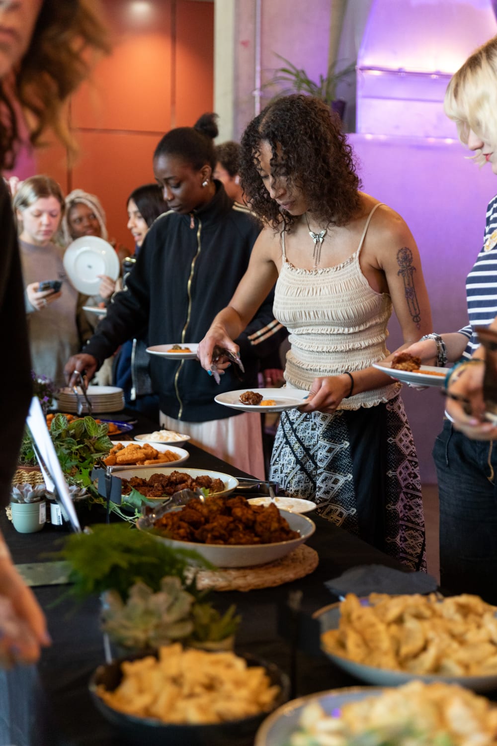 Guests serving themselves food from a buffet