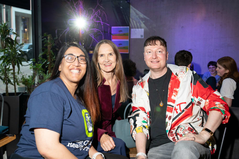 Guests smiling into the camera