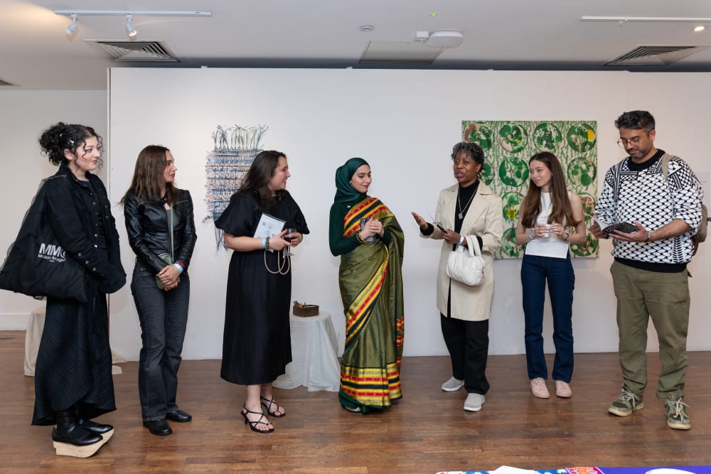 People standing in a line giving a speech