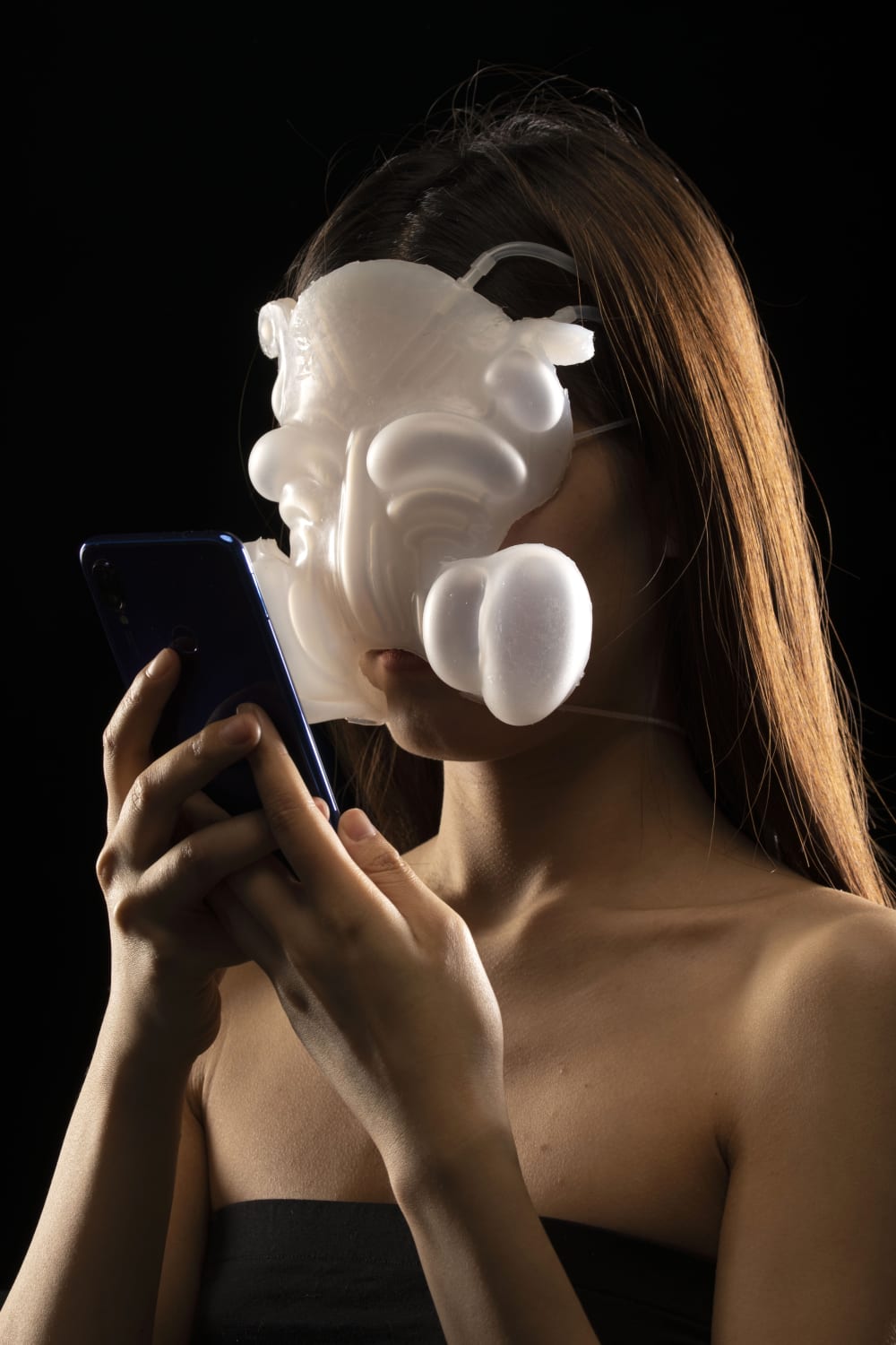 A person wearing a 3d white mask