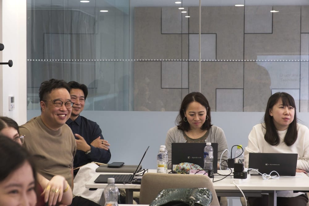 People listening to someone speak