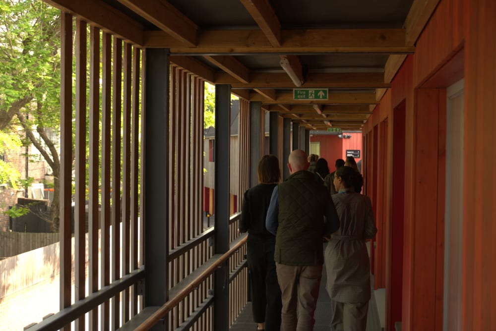 People walking outside a building.