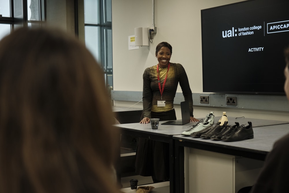 Person talking to table of people