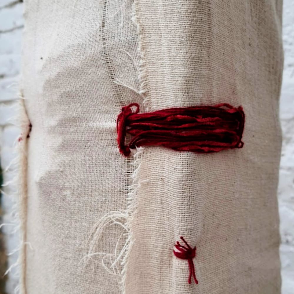 thread wrapped around fabric