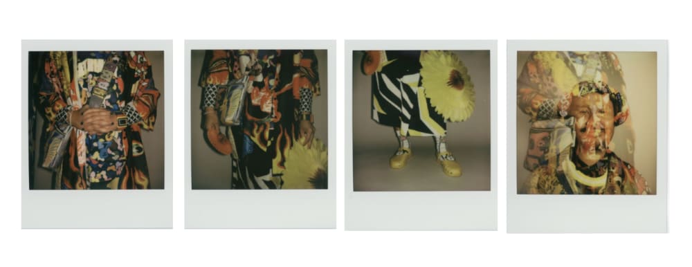 A wall of polaroids, showing different members of the UAL LGBTQ+ community.