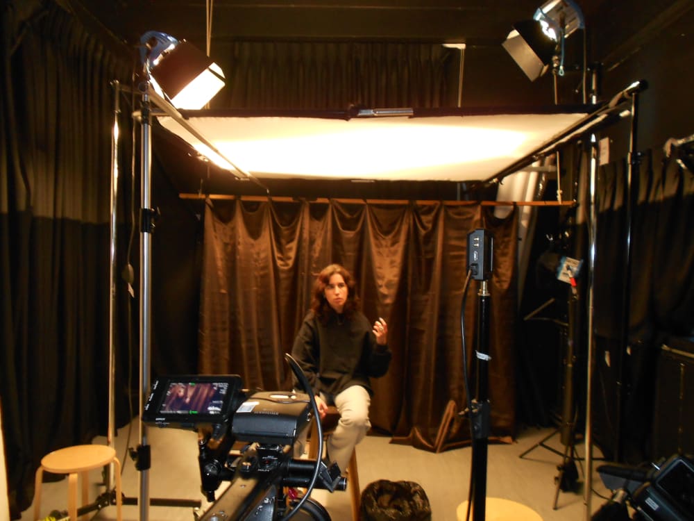 Blanca shot in motion whilst talking on film set