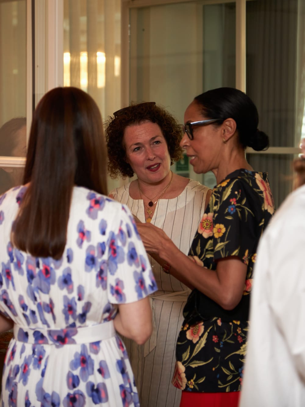 three people networking at an event