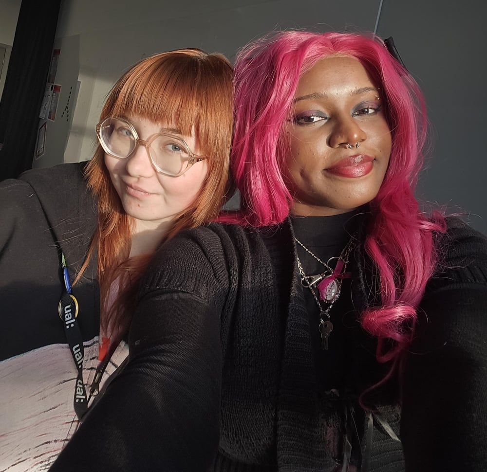 Two people smiling at camera