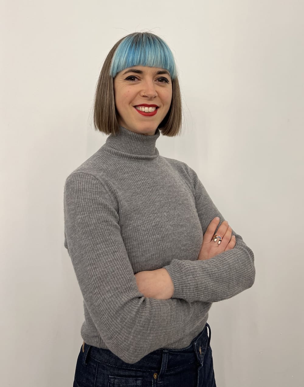 Photo of Gabrielle standing with her arms folded