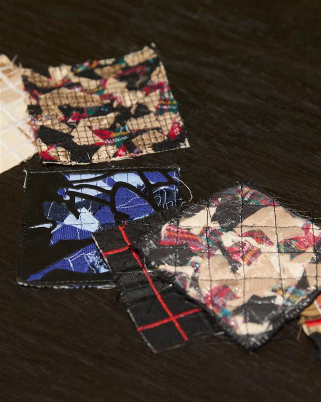 Photo of square cut out fabric samples.