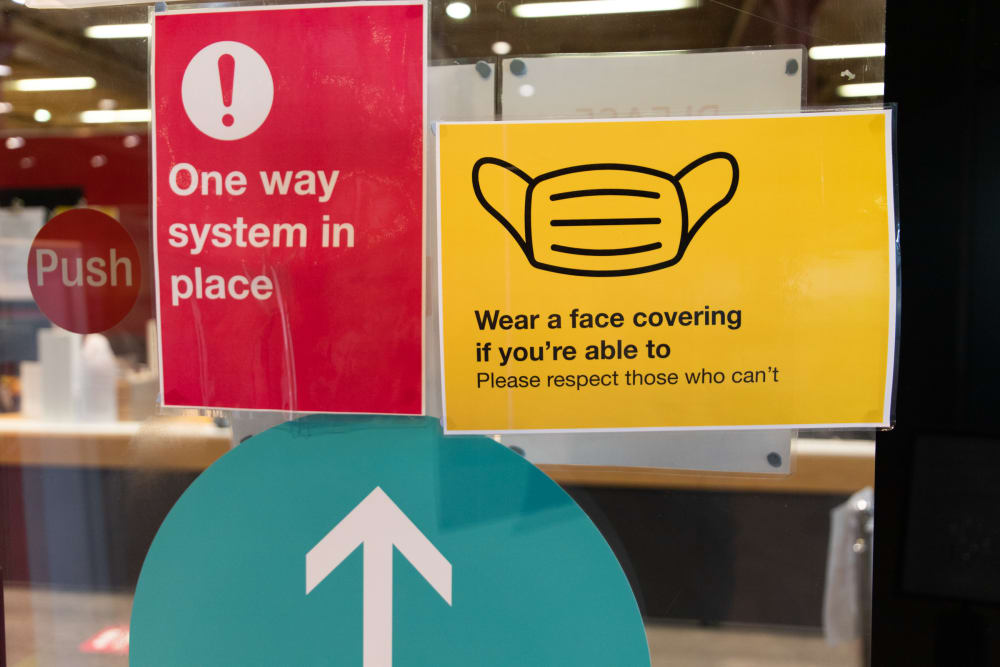 Safety signage reminding students and staff to wear face coverings