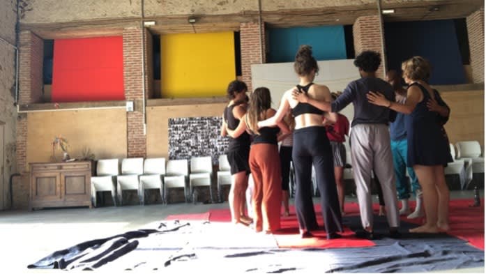 a group of people huddling together