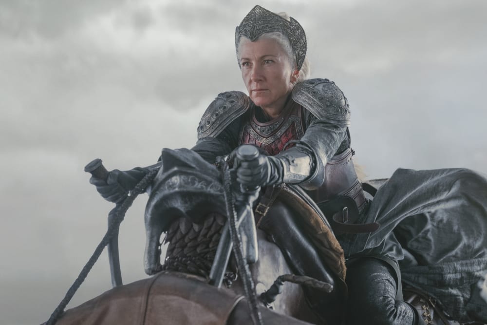 Image shows a woman with leather armour on atop an animal riding in the sky