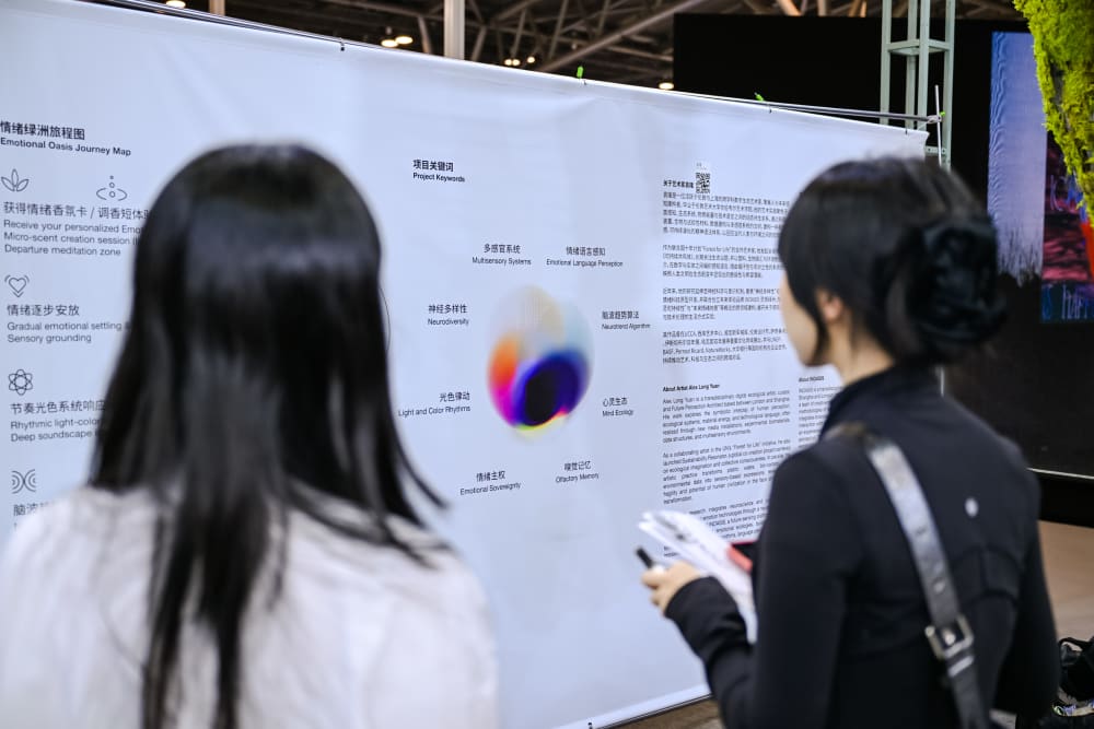 People reading an exhibition panel in Chinese  