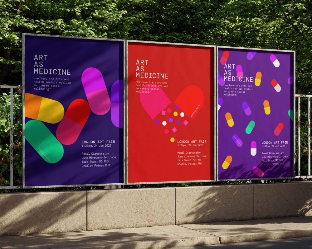 three graphic design posters on the street