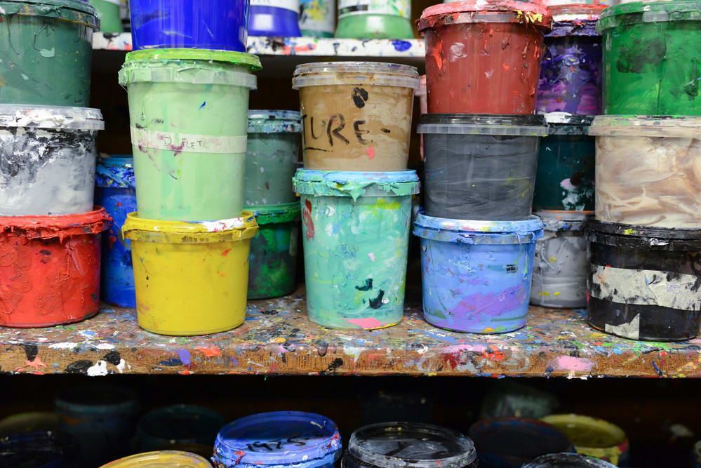 Paint pots on a shelf