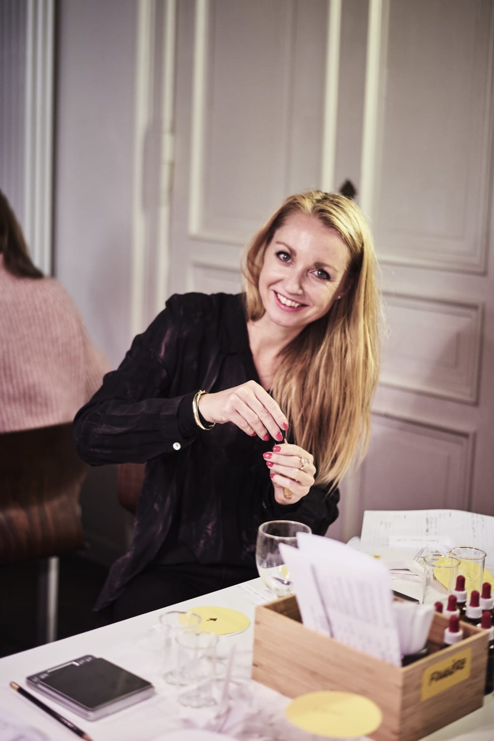 A guest creating her own perfume