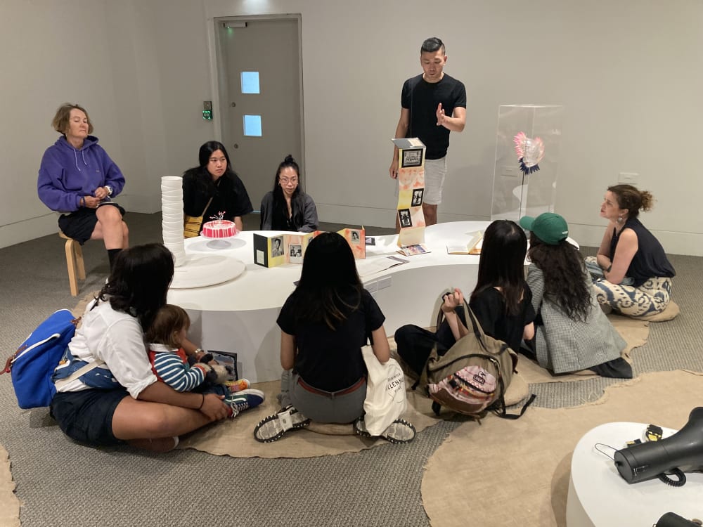 Curators and students sat around the exhibition space