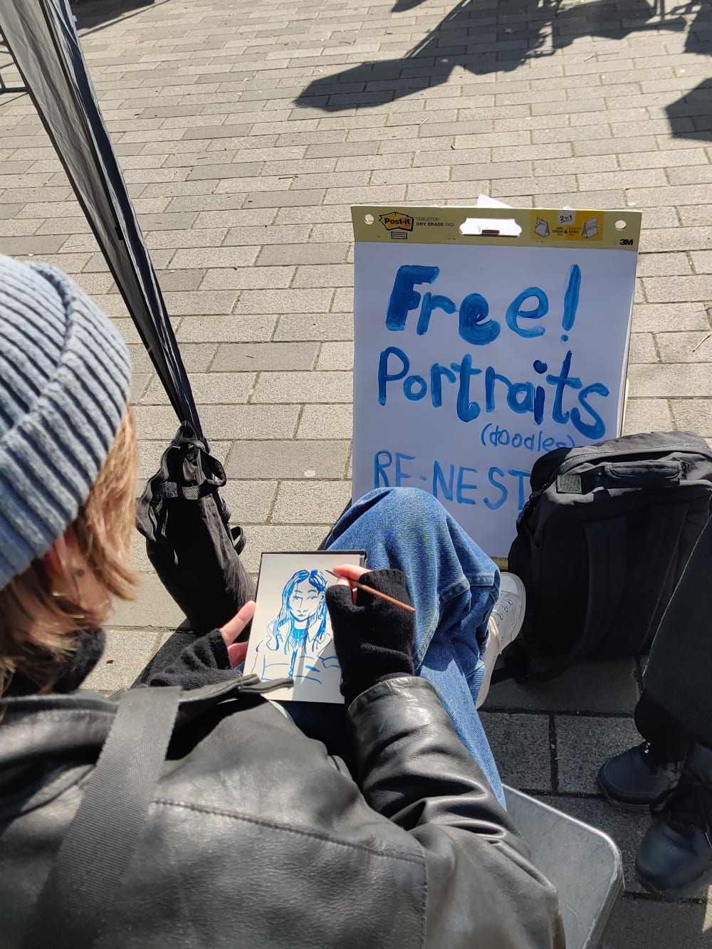 A student drawing a free portrait 