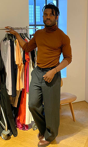 Kolin Ekeocha standing with is collection