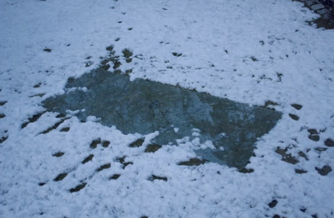 Glass panel in snowy ground 