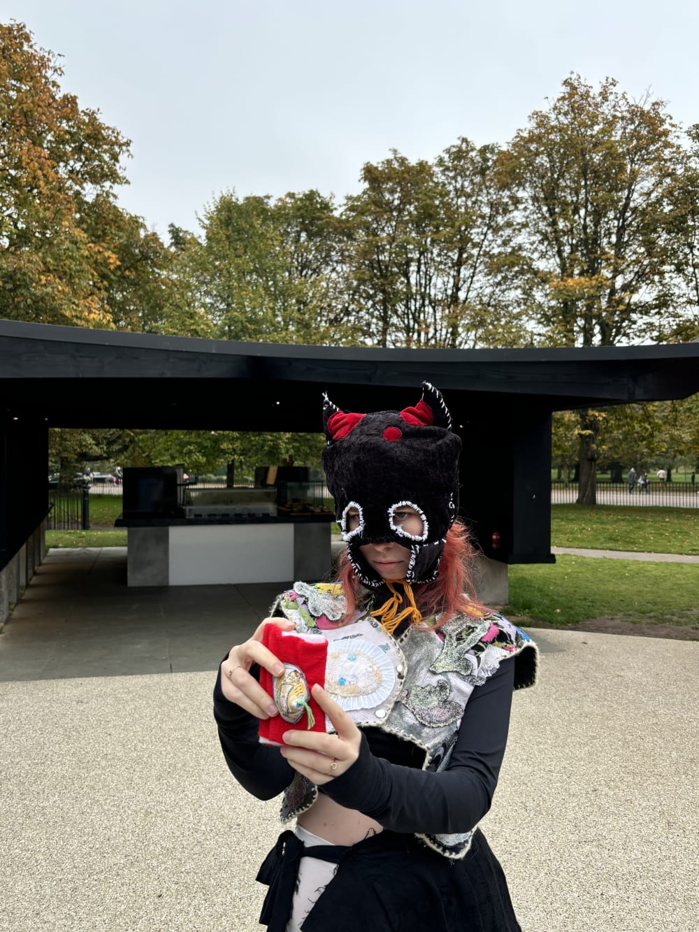 Close up of a model wearing a modern headdress outside