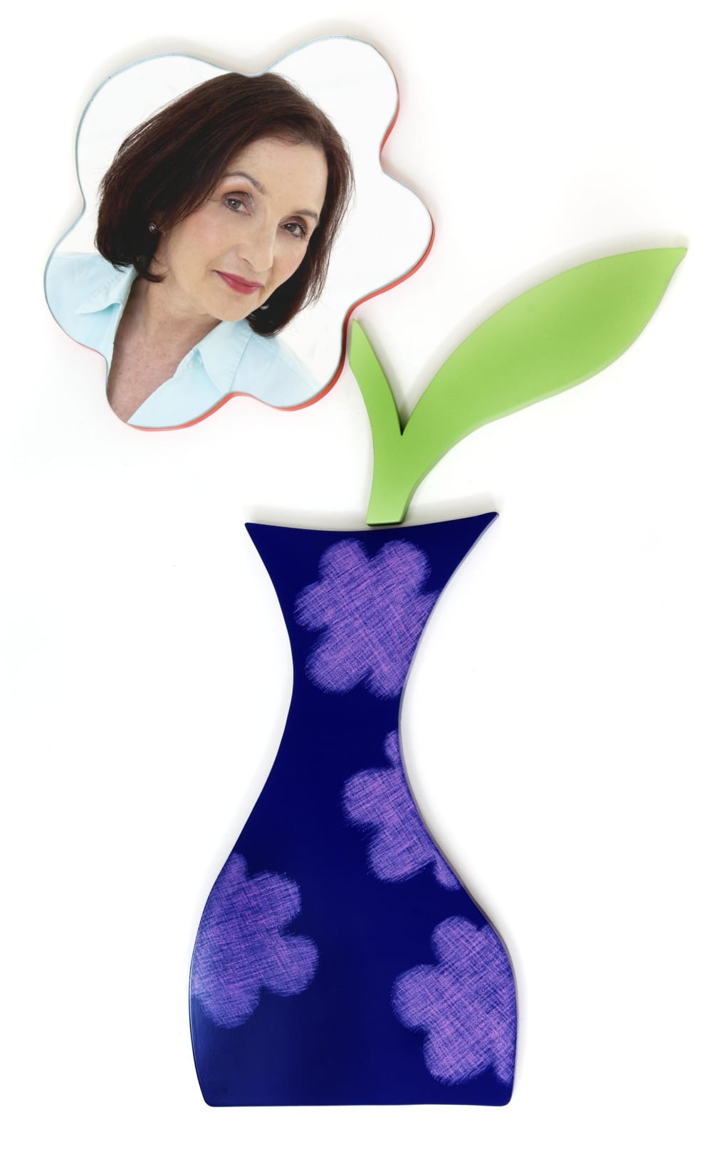 Mirror shaped like a flower with a photo of Brenda next to it