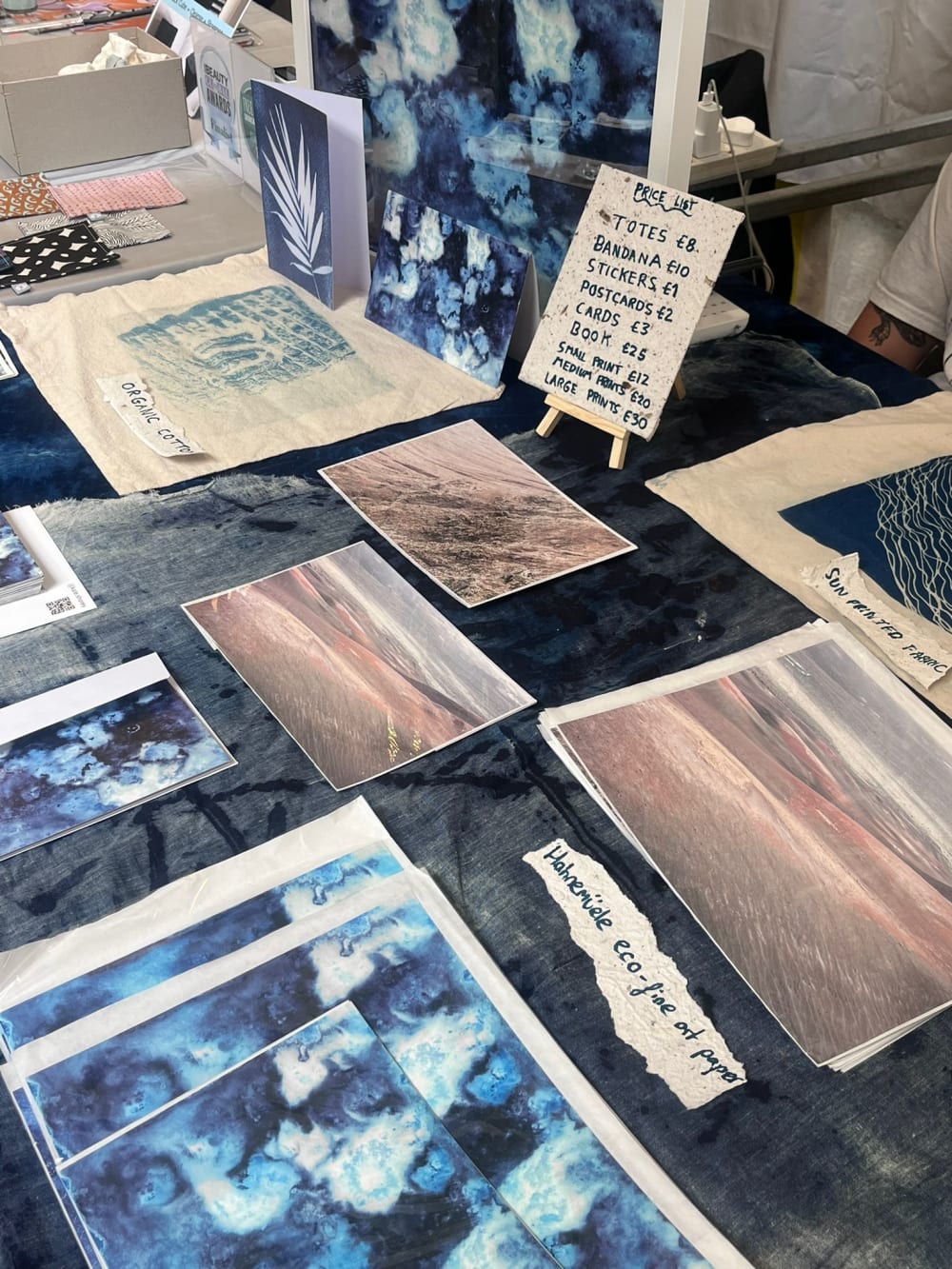 Stallholder showcasing artworks