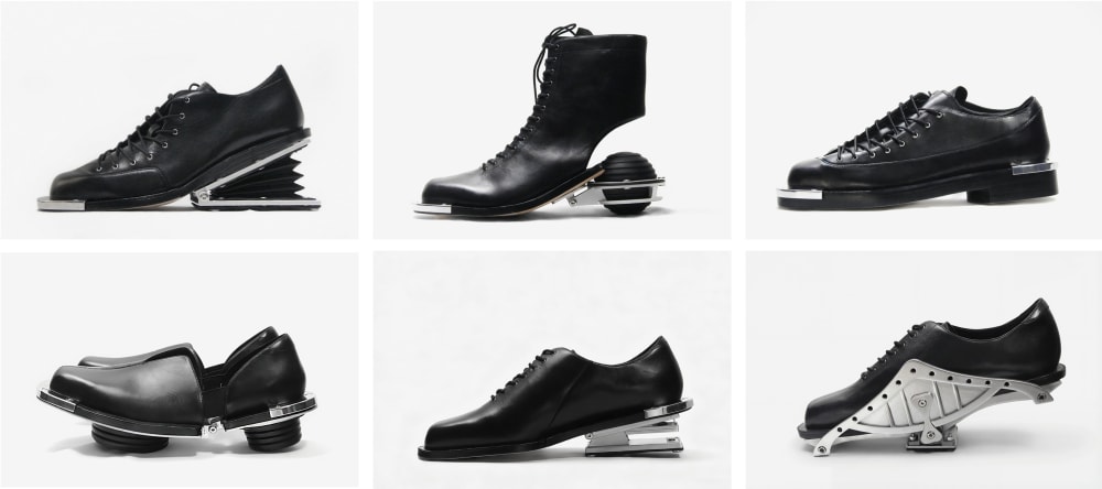 A grid of six black shoes, each with unique, futuristic heel designs. Styles include boots and oxfords, featuring springs, platforms, and metallic elements.