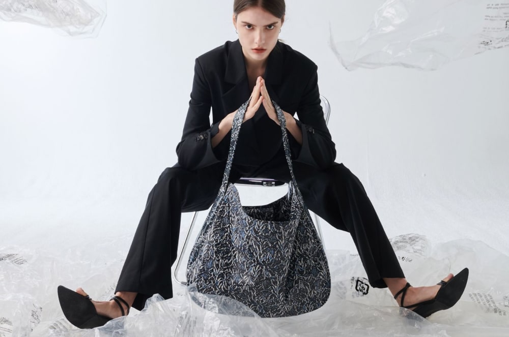 A model wearing a circular-design bag
