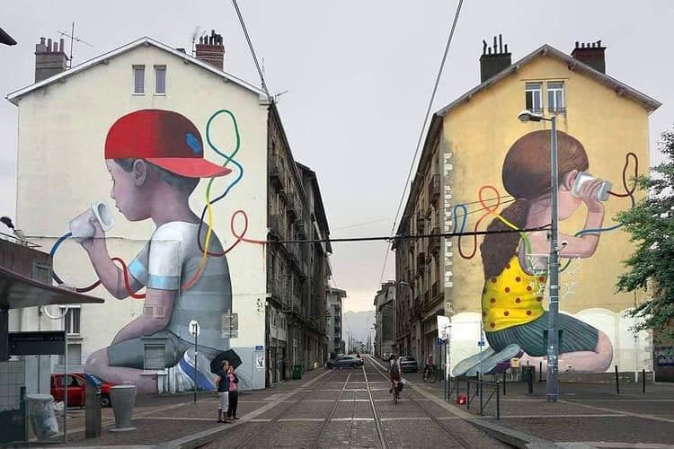 Graffiti on the side of 2 buildings